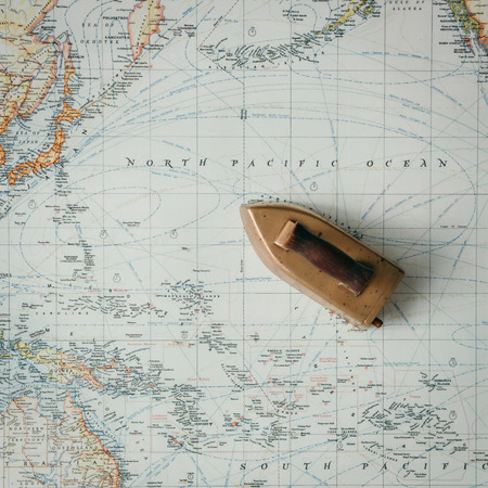 Flat lay adventure map with ship-like ironの写真素材