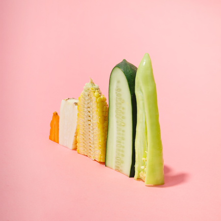 Various vegetables sliced in half. Minimal concept.の写真素材