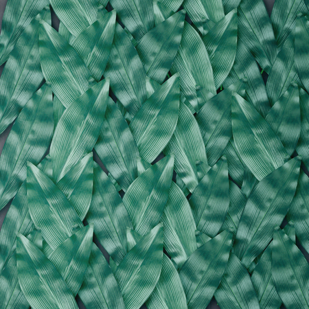 Wallpaper pattern made of green blue leaves. Tropical concept.の写真素材