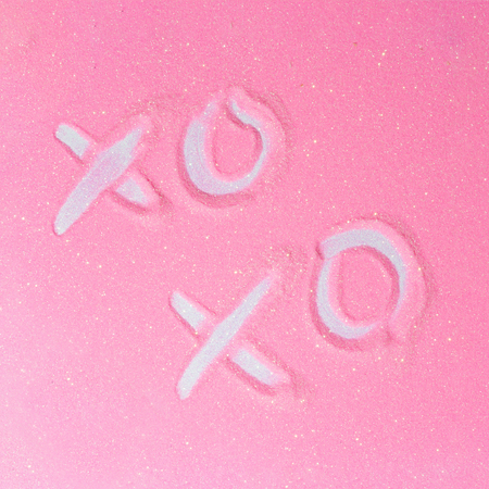 Pink glitter background with XO XO slogan. Flat lay shiny texture. Hipster love concept.の写真素材