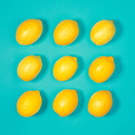 Lemon pattern on pastel blue background. Minimal summer concept. Flat lay.