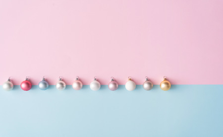Minimal colorful Christmas baubles in pastel colors. Holiday concept. Flat lay.の写真素材