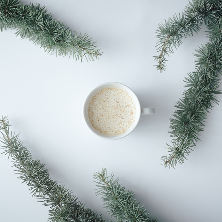 Winter Christmas table layout with coffee cup on pastel grey background. Minimal nature concept. Flat lay top view compositionの写真素材