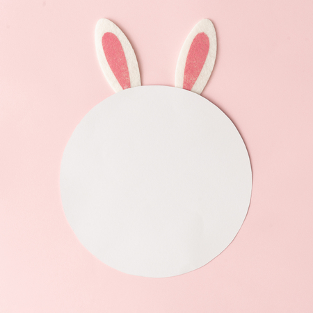 Bunny rabbit ears on pastel pink background with creative copy space. Happy Easter minimal concept. Flat lay.の写真素材
