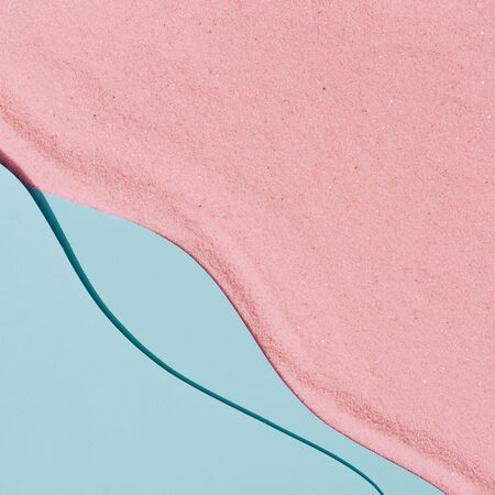 Minimal top view of pink sand beach and sea waves. Minimal summer background.の写真素材