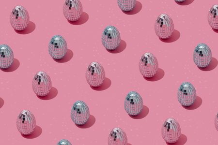 Disco ball Easter eggs pattern in pink and blue pastel colors. Easter holiday creative concept...