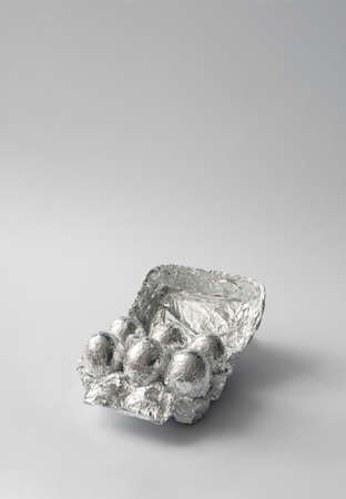 2021 Easter unique and real still life composition. Eggs in aluminum foil. Space travel and food...