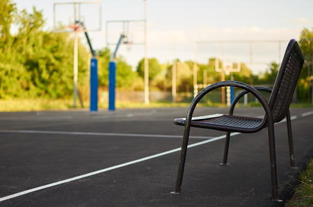 Bench near basketball court.の写真素材