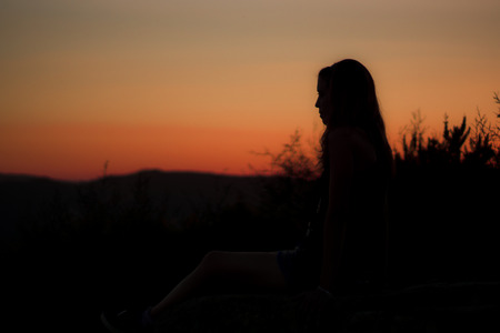 SUNSET GIRL SILHOUETTEの写真素材