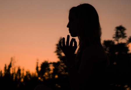 SUNSET GIRL SILHOUETTEの写真素材