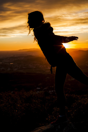 SUNSET GIRL SILHOUETTEの写真素材