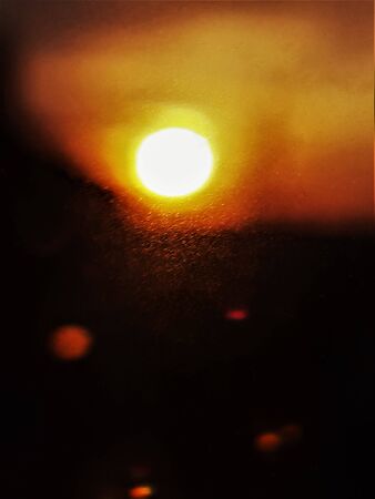 evening sunset view through frosted glassの写真素材