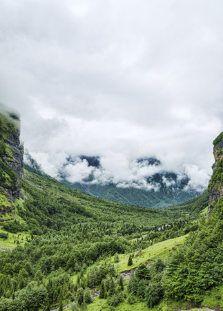 Green Mountain valley among rock walls summer landscapeの写真素材
