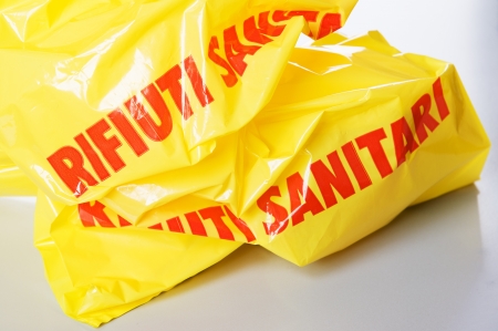 yellow medical waste bag with red writtenの写真素材