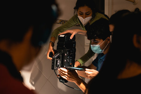 Behind the scenes of a team of film students making a short film
