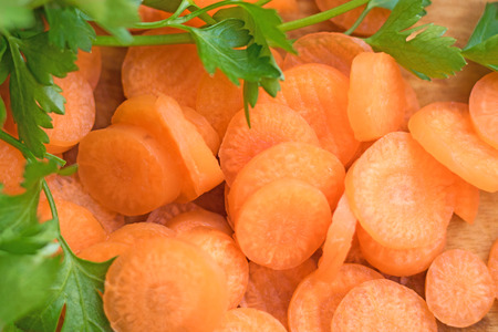 carrot cut into rings and parsleyの写真素材