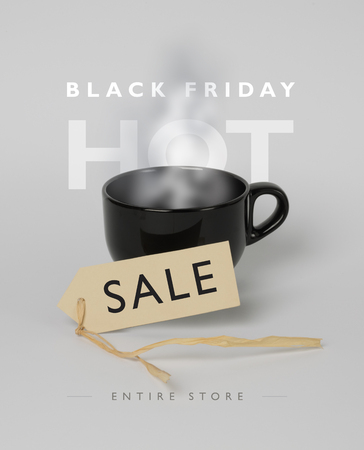 Banner for Black Friday hot sale. Black, steaming mug, price-tag in front of it. Grey background.の写真素材
