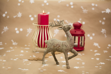 Christmas holiday composition. Wooden deer figurine in front plan.の写真素材