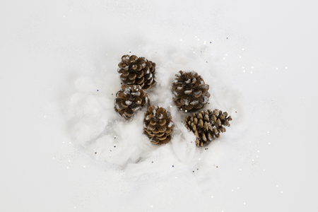 Winter composition â pinecones with silver sequins on white background.の写真素材