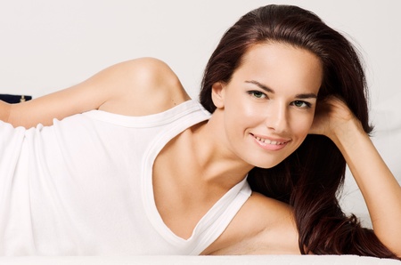 Beautiful woman laying. Morning lifestyle photoの写真素材