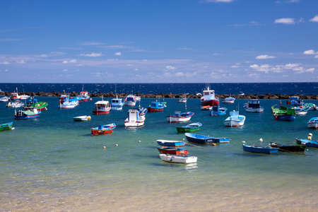 many boats are in the calm blue lagoonのeditorial素材
