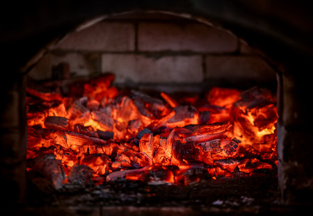 Flame of fire from hot burning coals in the fireplace. Heat from the oven.の写真素材