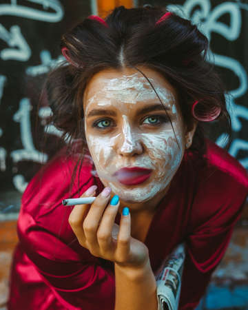 Girl in home clothes walking, wearing a mask, and with milkの写真素材