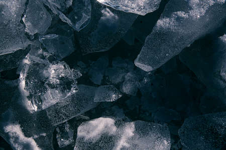 Texture of ice on the river, broken into cracks,の写真素材