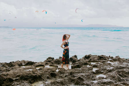 women on the beach in the tropics, in the Philippinesの写真素材