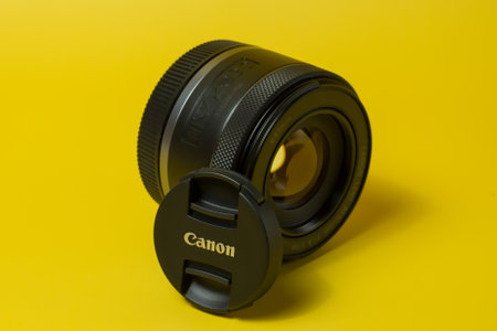 Canon RF 50mm lens, digital camera, on yellow background, for advertisingのeditorial素材