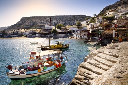 Fishing boats in Matala harbor in Crete, Greece の写真素材
