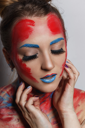 Fashion model girl portrait with colorful make upの写真素材