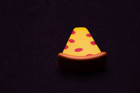 Toy plastic fruits and food isolated on black backgound. Toys for children's kitchenの写真素材