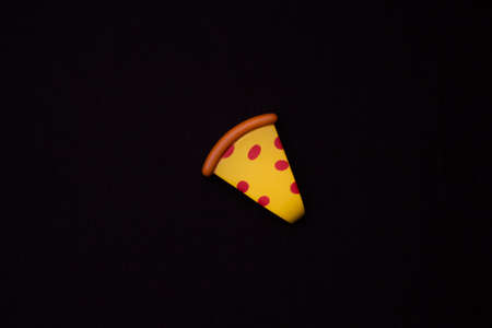 Toy plastic fruits and food isolated on black backgound. Toys for children's kitchenの写真素材