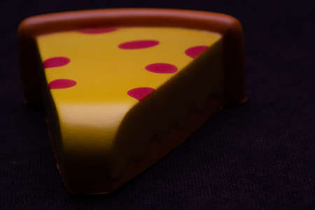 Toy plastic fruits and food isolated on black backgound. Toys for children's kitchenの写真素材