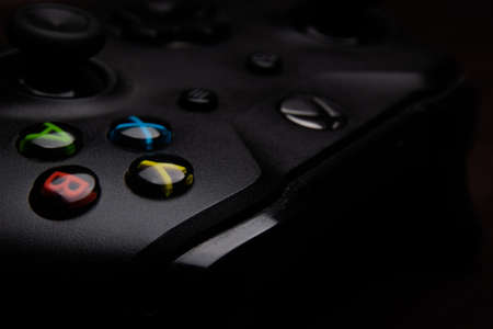 Saint-Petersburg-18 August, 2020: Joystick for game console on black background. Game console with a joystick. Home video game console.のeditorial素材