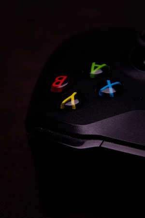 Saint-Petersburg-18 August, 2020: Joystick for game console on black background. Game console with a joystick. Home video game console.のeditorial素材
