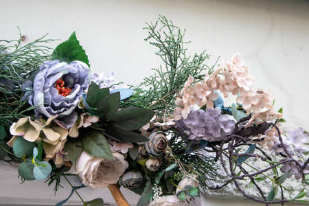 Vintage Beautiful multicolored artificial flowers backgroundの写真素材