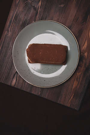 Two almond biscuits on a stone slab.の写真素材