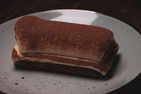 Photo of tiramisu cake close-up on a plateの写真素材