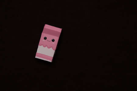 Adorable squishy toy on black background.
