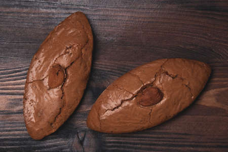 Delicious almond cookies on a wooden backgroundの写真素材