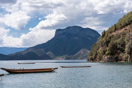 Pig trough boats on the surface of Lugu Lake in Chinaの写真素材