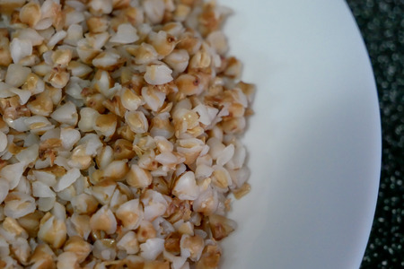 Buckwheat porridge in white plate. Healthy food.の写真素材