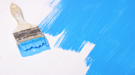 Brush with blue paintの写真素材