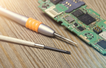 screwdriver and dismantle the phoneの写真素材