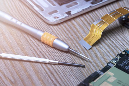 screwdriver and dismantle the phoneの写真素材