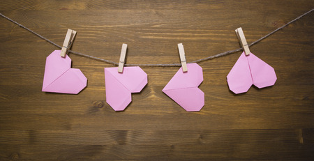 Paper hearts on clothespinsの写真素材