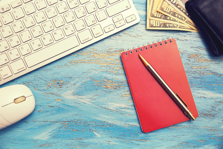 keyboard, notebook and moneyの写真素材