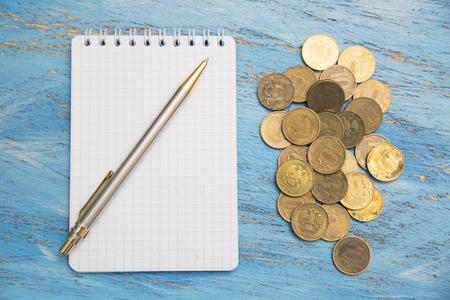 money, notebook and penの写真素材